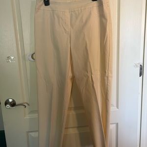 Size 12, crème slacks, never worn. Stretchy waistband, scalloped hem.